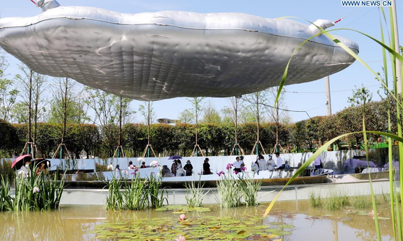 People visit the 10th China Flower Expo in east China's Shanghai, May 21, 2021. The 10th China Flower Expo opened here on Friday, welcoming over 20,000 visitors on its first day. The expo, held to showcase the development of China's flower industry, will last until July 2. A total of 180 outdoor exhibition zones and 64 indoor areas have been set up at the expo park in the city's Chongming District.(Photo: Xinhua)