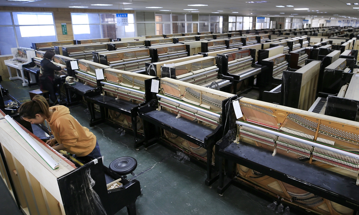 Pianos ready for assembly in a factory in Luoshe town, East China's Zhejiang Province. Photo: Yang Hui/GT 