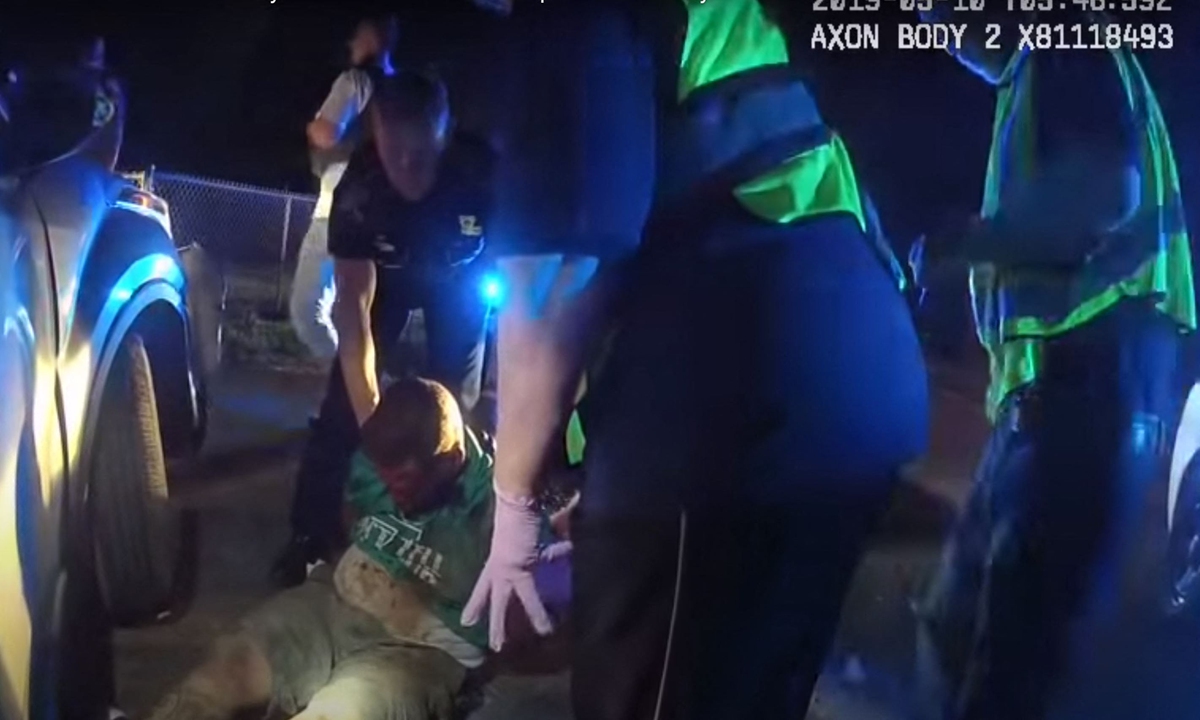 This screengrab made from police bodycam footage released by the Louisiana State Police on their official YouTube channel on May 22, 2021 shows Ronald Greene's arrest in 2019. Initial claims by Louisiana authorities that a Black man stopped after a high-speed chase had died of crash-related injuries were undercut this week by newly released video showing police tasing, dragging, choking and beating the man. Photo: AFP