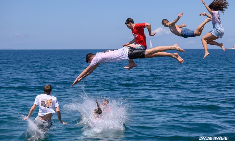 Secondary school students jump into the sea to celebrate the end of a school year in Zadar, Croatia, on May 25, 2021. The celebration of Norijada (Crazy Day) is held annually nationwide in Croatia to mark the end of a school year.(Photo: Xinhua)