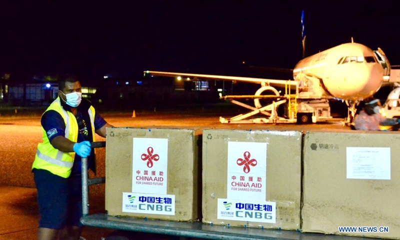 A staff member conveys Chinese-made COVID-19 vaccines at an airport in Honiara, Solomon Islands, April 11, 2021. Photo: Xinhua