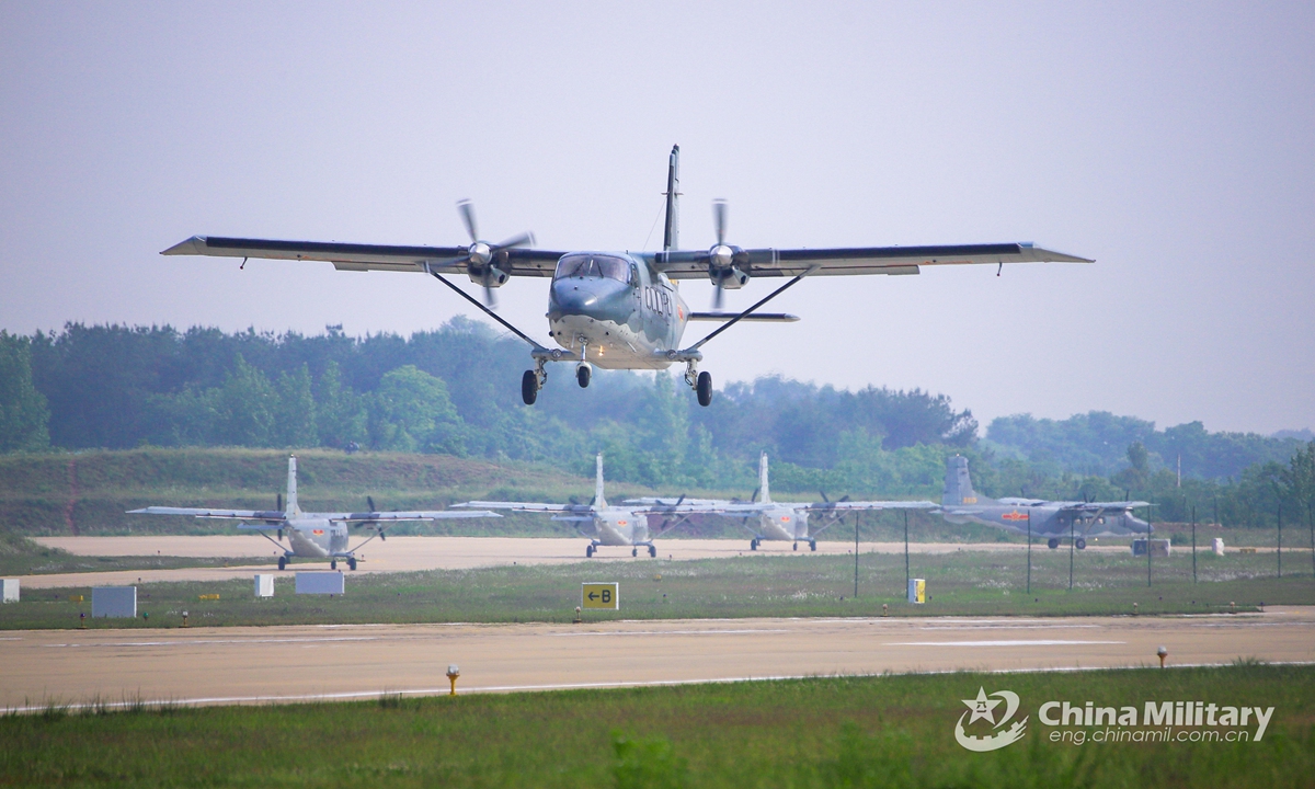 Y-12 transport aircraft assigned to an air transport brigade under the PLA airborne troops take off in sequence during a joint transportation training exercise that involves multiple types of transport aircraft on May 21, 2021. (eng.chinamil.com.cn/Photo by Li Zhuojun)