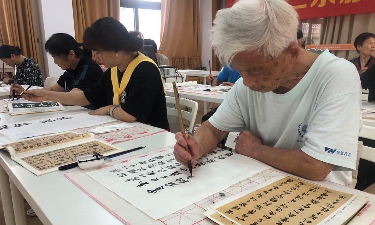 Residents in Hemu community in Hangzhou, East China’s Zhejiang Province, practice Chinese calligraphy in a class designed for senior people. Photo: Chen Shasha/GT