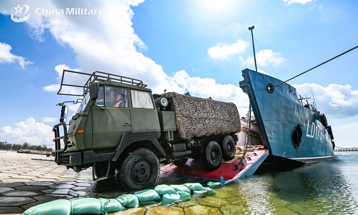 A 6x6 military truck attached to a brigade of the PLA 73rd Group Army pulls out of a military RO-RO ferry vessel during a loading-unloading training exercise from May 18 to 21, 2021. (eng.chinamil.com.cn/Photo by Lin Jiayu)