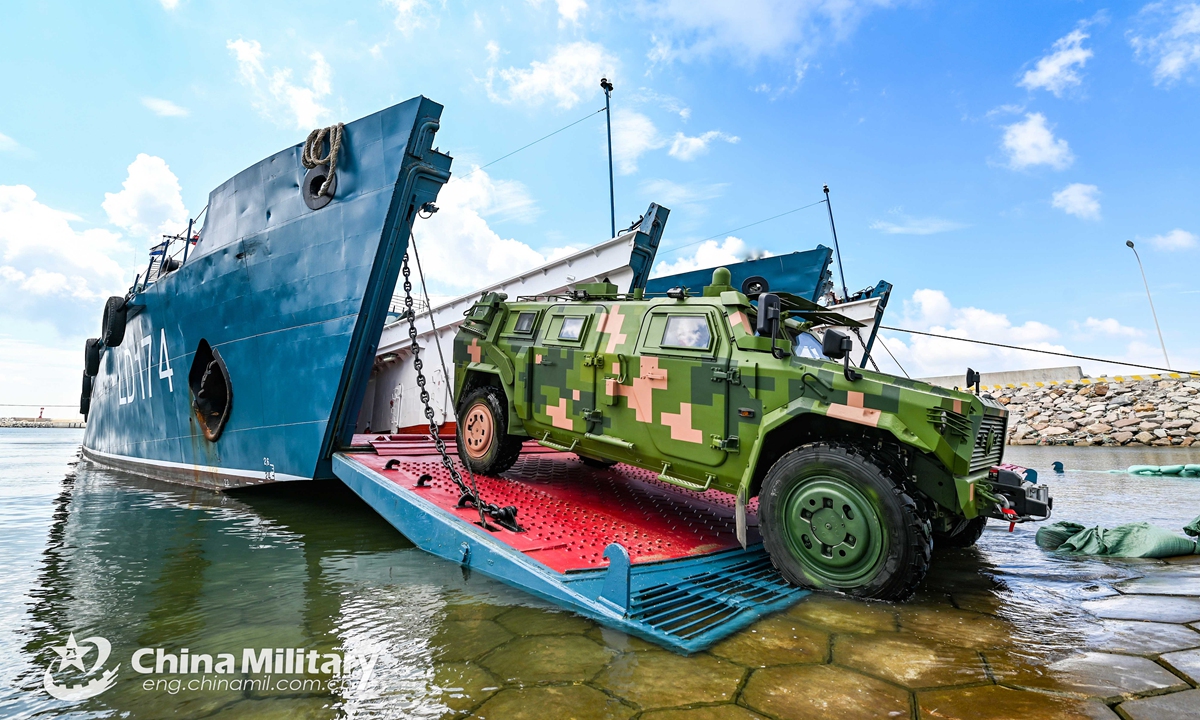 A 4x4 off-road military vehicle attached to a brigade of the PLA 73rd Group Army pulls out of a military RO-RO ferry vessel during a loading-unloading training exercise from May 18 to 21, 2021. (eng.chinamil.com.cn/Photo by Lin Jiayu)