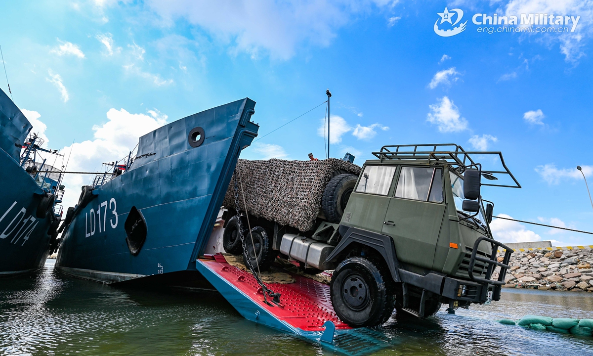 A 6x6 military truck attached to a brigade of the PLA 73rd Group Army pulls out of a military RO-RO ferry vessel during a loading-unloading training exercise from May 18 to 21, 2021. (eng.chinamil.com.cn/Photo by Lin Jiayu)