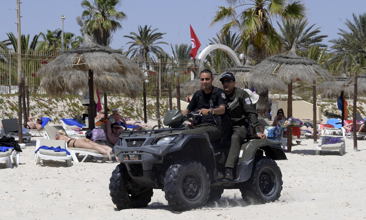 Tunisian police on a quad bike patrol a beach in the Tunisian Mediterranean resort of Sousse on May 22. Photo: AFP