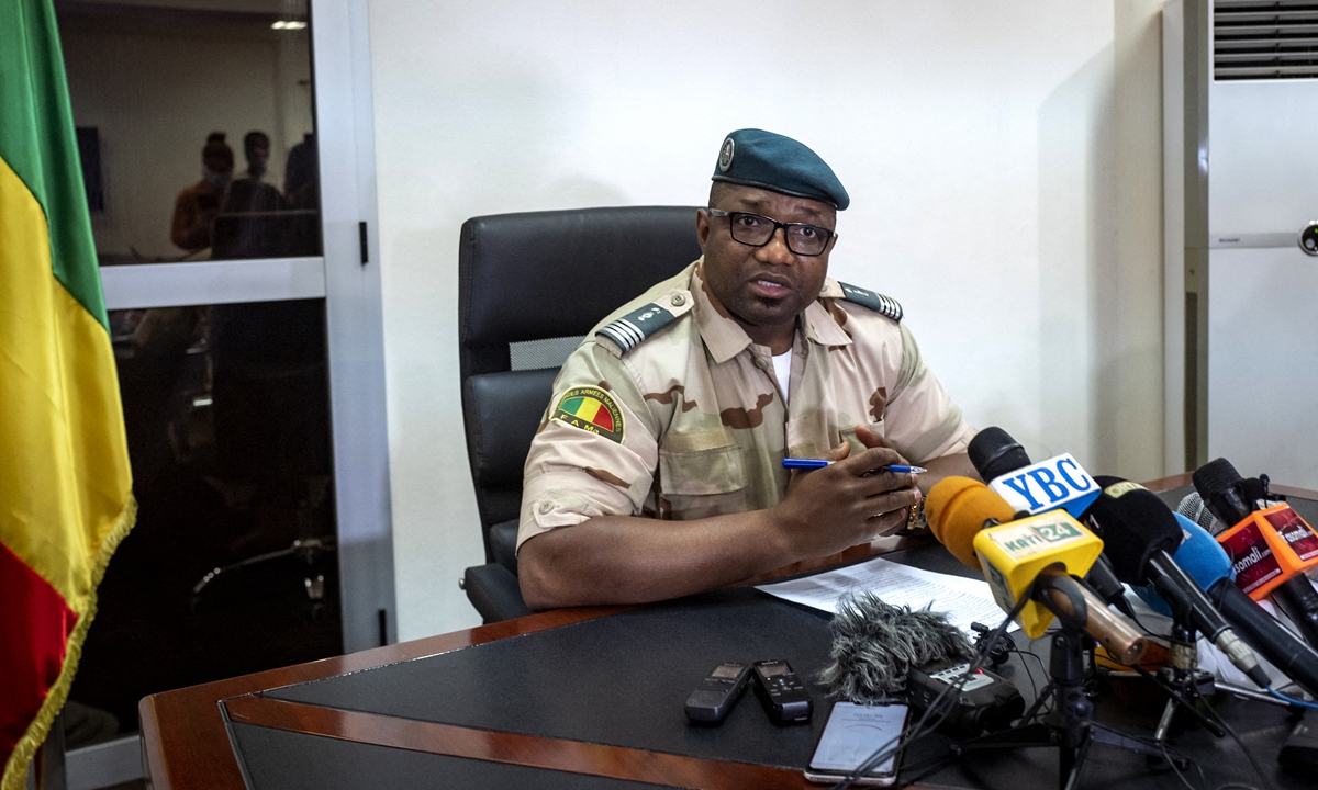 Commandant Baba Cisse addresses the press in Bamako, Mali on Wednesday announcing that Mali's president and prime minister will be gradually released. Photo: AFP