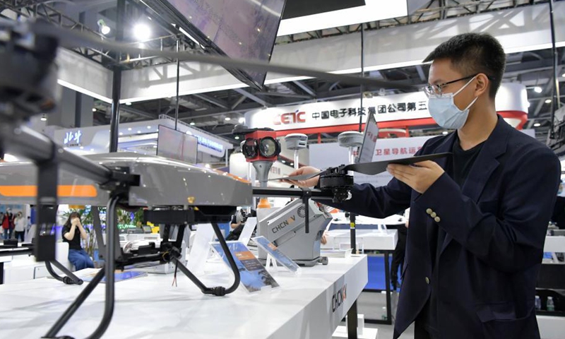 An exhibitor shows a drone for forest fire alert and monitoring during the 12th China Satellite Navigation Expo (CSNE) in Nanchang, capital of east China's Jiangxi Province, May 27, 2021. Photo: Xinhua