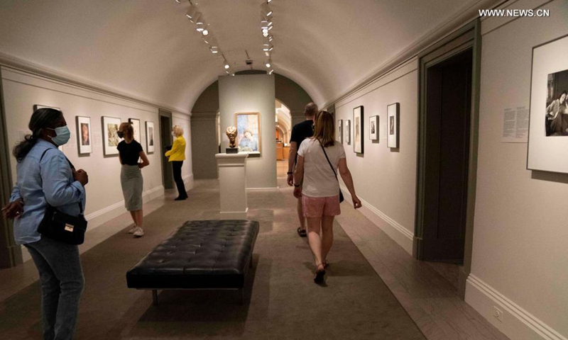 Visitors view artworks during the exhibition Her Story: A Century of Women Writers at the National Portrait Gallery in Washington, D.C., the United States, on May 27, 2021. The exhibition which will last till Jan. 23, 2022, features 24 women from diverse backgrounds whose books have become classics and whose words are well known. Photo: Xinhua