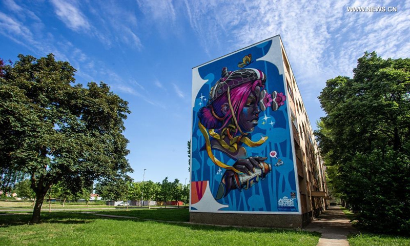 A mural is seen on the wall of a building in Vukovar, Croatia, May 27, 2021. Street art festival VukovART, which features murals created by world-famous artists on the walls and sidewalks, is held in Vukovar for the fifth year in a row. Photo: Xinhua