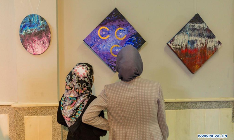 Visitors view artworks during a COVID-19 awareness exhibition in Herat city, Afghanistan, May 27, 2021. A seven-day art exhibition kicked off in Herat province on Thursday to raise public awareness of the COVID-19 pandemic.Photo:Xinhua