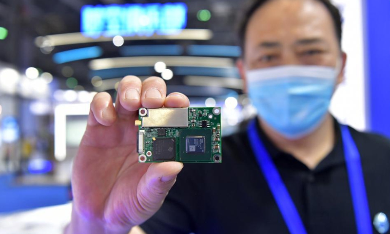 An exhibitor shows a module with an anti-jamming chip during the 12th China Satellite Navigation Expo (CSNE) in Nanchang, capital of east China's Jiangxi Province, May 27, 2021. Photo: Xinhua