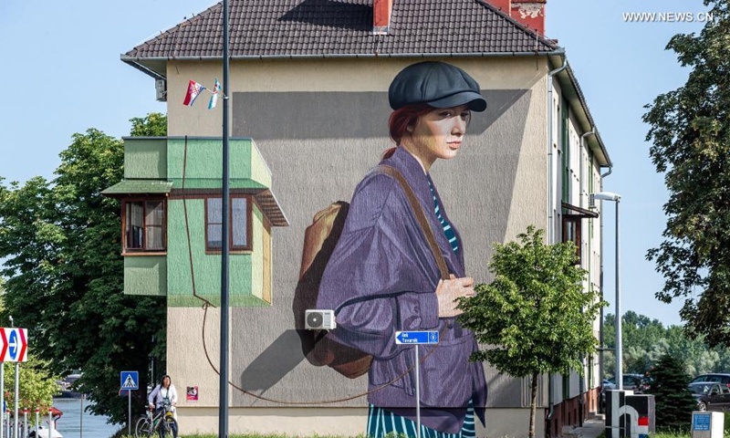 A mural is seen on the wall of a building in Vukovar, Croatia, May 27, 2021. Street art festival VukovART, which features murals created by world-famous artists on the walls and sidewalks, is held in Vukovar for the fifth year in a row.  Photo: Xinhua