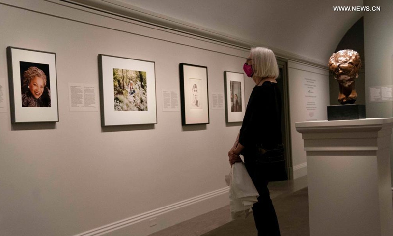A visitor views a photograph during the exhibition Her Story: A Century of Women Writers at the National Portrait Gallery in Washington, D.C., the United States, on May 27, 2021. The exhibition which will last till Jan. 23, 2022, features 24 women from diverse backgrounds whose books have become classics and whose words are well known. Photo: Xinhua