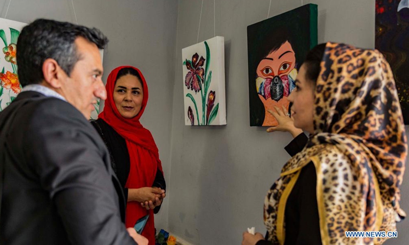 Visitors view artworks during a COVID-19 awareness exhibition in Herat city, Afghanistan, May 27, 2021. A seven-day art exhibition kicked off in Herat province on Thursday to raise public awareness of the COVID-19 pandemic.Photo:Xinhua