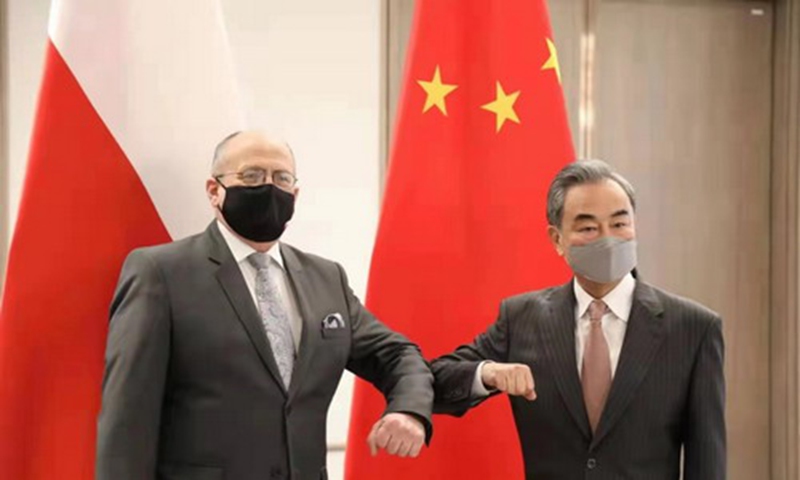 Chinese State Councilor and Foreign Minister Wang Yi (right) Wang Yi and Poland's Minister of Foreign Affairs Zbigniew Rau Photo: website of Chinese Foreign Ministry  
