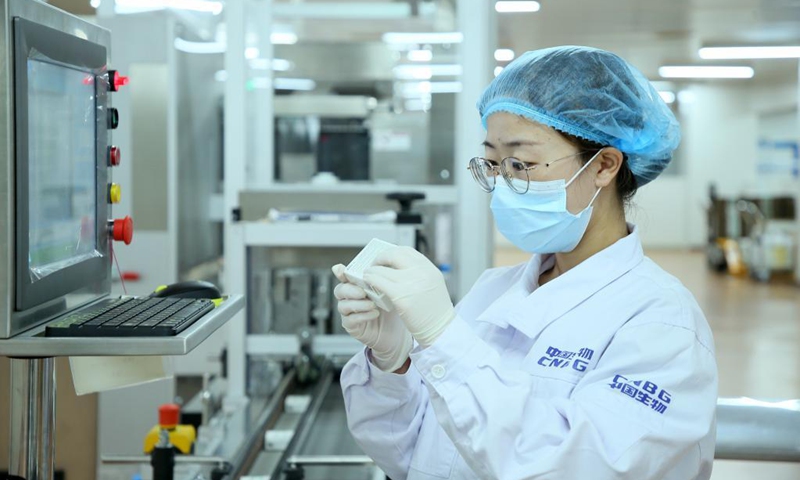 A staff member checks the packaging of the Sinopharm vaccines in Beijing, capital of China, May 31, 2021. China on Tuesday said the first batch of Chinese vaccines supplied to COVAX officially rolled off the production line, which is another important reflection of China's commitment to making its COVID-19 vaccines global public goods with concrete actions.Photo: Xinhua

