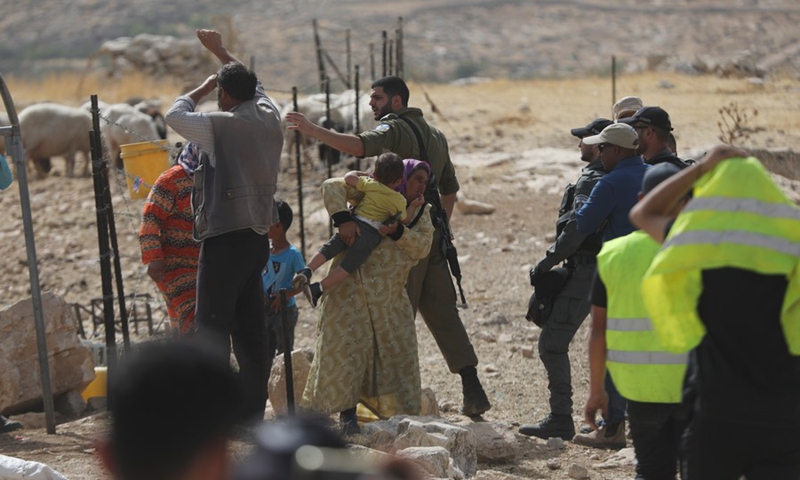 Palestinians react as Israeli military confiscate their tent in Zif village, south of the West Bank city of Hebron, on May 31, 2021. (Photo: Xinhua)