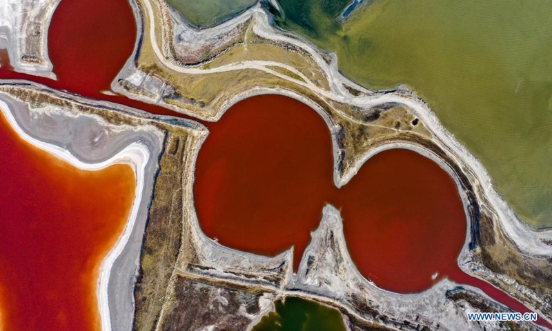 Aerial photo taken on June 1, 2021 shows a view of the salt lake in Yuncheng City, north China's Shanxi Province. Yuncheng Salt Lake, known as the Dead Sea of China, has transformed from a salt production base to a photographers' paradise for its vibrant colors. (Xinhua/Cao Yang)