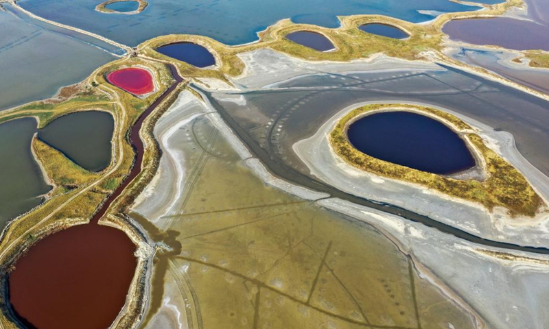 Aerial photo taken on June 1, 2021 shows a view of the salt lake in Yuncheng City, north China's Shanxi Province. Yuncheng Salt Lake, known as the Dead Sea of China, has transformed from a salt production base to a photographers' paradise for its vibrant colors. (Xinhua/Cao Yang)