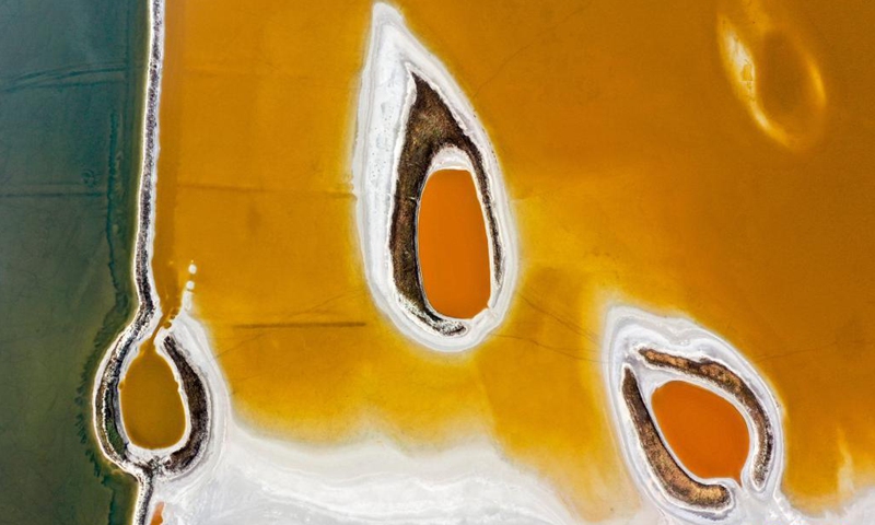 Aerial photo taken on June 1, 2021 shows a view of the salt lake in Yuncheng City, north China's Shanxi Province. Yuncheng Salt Lake, known as the Dead Sea of China, has transformed from a salt production base to a photographers' paradise for its vibrant colors. (Xinhua/Cao Yang)