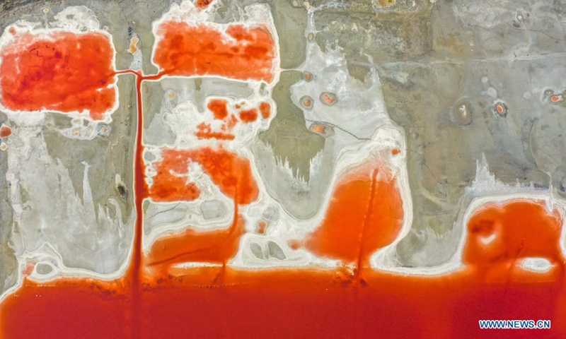 Aerial photo taken on June 1, 2021 shows a view of the salt lake in Yuncheng City, north China's Shanxi Province. Yuncheng Salt Lake, known as the Dead Sea of China, has transformed from a salt production base to a photographers' paradise for its vibrant colors. (Xinhua/Cao Yang)