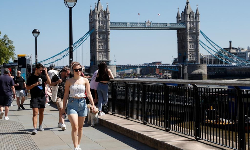 People walk along the River Thames, backdropped by the Tower Bridge, in London, Britain, June 1, 2021. Britain remains in a vulnerable position in fighting coronavirus despite the progress of the country's vaccination program, a scientist advising the British government said Tuesday. Professor Adam Finn from the Joint Committee on Vaccination and Immunisation, which advises the government on vaccine priority, said the job to contain the pandemic is not done as large numbers of people are still unvaccinated.(Photo: Xinhua)