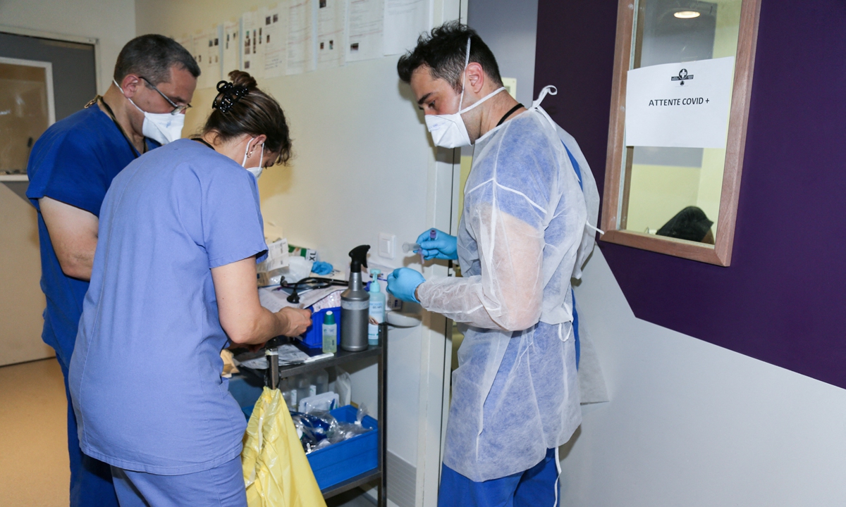 Healthcare staff work upon their arrival at The Hospital Martial Henry in Pamandzi, on the French Indian Ocean island of Mayotte, on March 1. Photo: AFP