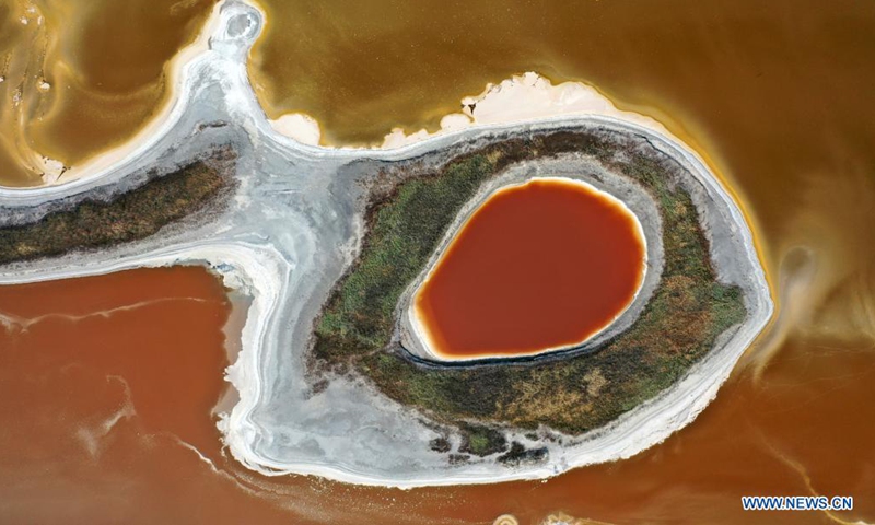Aerial photo taken on June 1, 2021 shows a view of the salt lake in Yuncheng City, north China's Shanxi Province. Yuncheng Salt Lake, known as the Dead Sea of China, has transformed from a salt production base to a photographers' paradise for its vibrant colors. (Xinhua/Cao Yang)