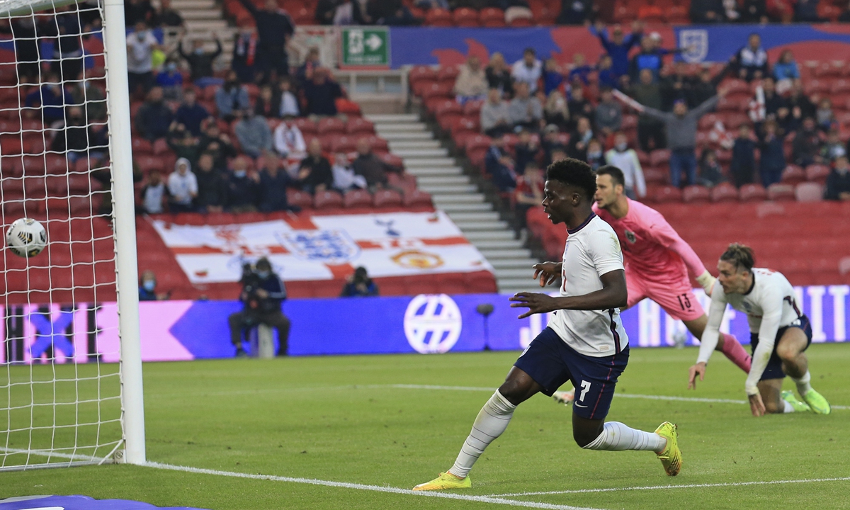 England's Bukayo Saka scores during the international friendly match against Austria on Wednesday in Middlesbrough, England. Photo: VCG