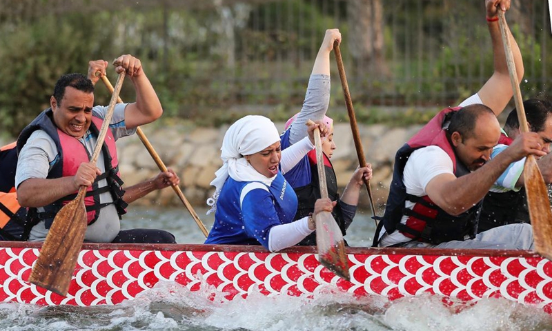Paddlers from Dragon Boat Egypt Academy attend a dragon boat training session in Cairo, Egypt, June 2, 2021. Dragon Boat Egypt Academy has organized a number of local and international dragon boat festivals in Egypt since 2016 to promote cultural exchanges. (Xinhua/Sui Xiankai)