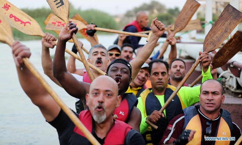 Paddlers from Dragon Boat Egypt Academy attend a dragon boat training session in Cairo, Egypt, June 2, 2021. Dragon Boat Egypt Academy has organized a number of local and international dragon boat festivals in Egypt since 2016 to promote cultural exchanges. (Xinhua/Sui Xiankai)