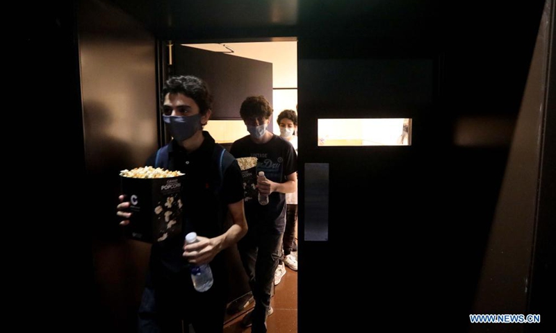 People are seen in a cinema in Beirut, Lebanon, on June 2, 2021. Lebanese caretaker Health Minister Hamad Hassan praised on Tuesday Lebanon's success in reducing remarkably the number of COVID-19 infections. (Photo by Bilal Jawich/Xinhua)