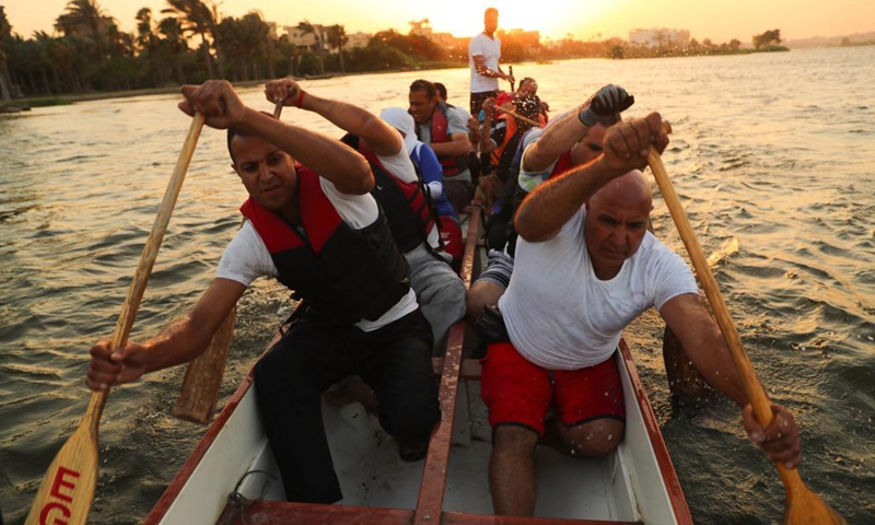 Paddlers from Dragon Boat Egypt Academy attend a dragon boat training session in Cairo, Egypt, June 2, 2021. Dragon Boat Egypt Academy has organized a number of local and international dragon boat festivals in Egypt since 2016 to promote cultural exchanges. (Xinhua/Sui Xiankai)