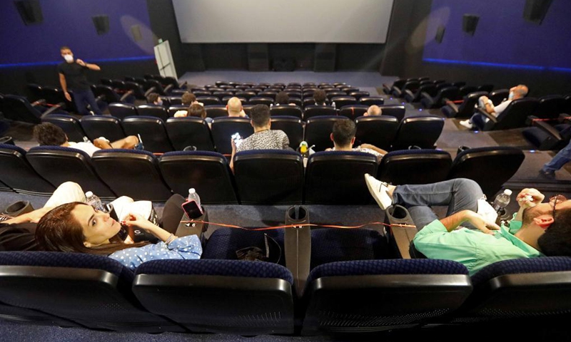 People are seen in a cinema in Beirut, Lebanon, on June 2, 2021. Lebanese caretaker Health Minister Hamad Hassan praised on Tuesday Lebanon's success in reducing remarkably the number of COVID-19 infections. (Photo by Bilal Jawich/Xinhua)