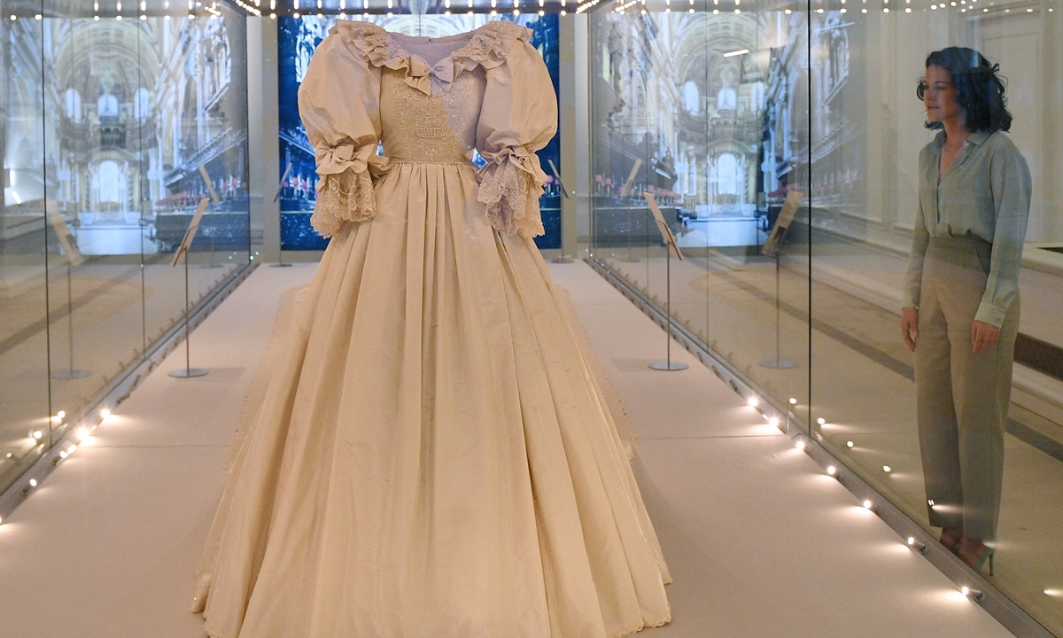 The wedding dress of Diana, princess of Wales, is seen on display at an exhibition in London on Wednesday. Photo: AFP
