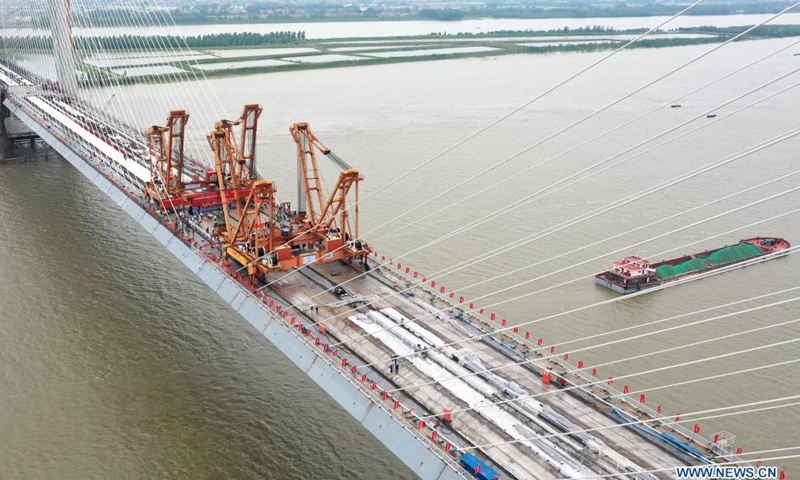 Aerial photo taken on June 3, 2021 shows the Bianyuzhou Yangtze River Bridge on the border of central China's Hubei Province and east China's Jiangxi Province. Connecting Huangmei County of central China's Hubei Province and Jiujiang City of east China's Jiangxi Province, the bridge is part of Anqing-Jiujiang Railway.Photo:Xinhua