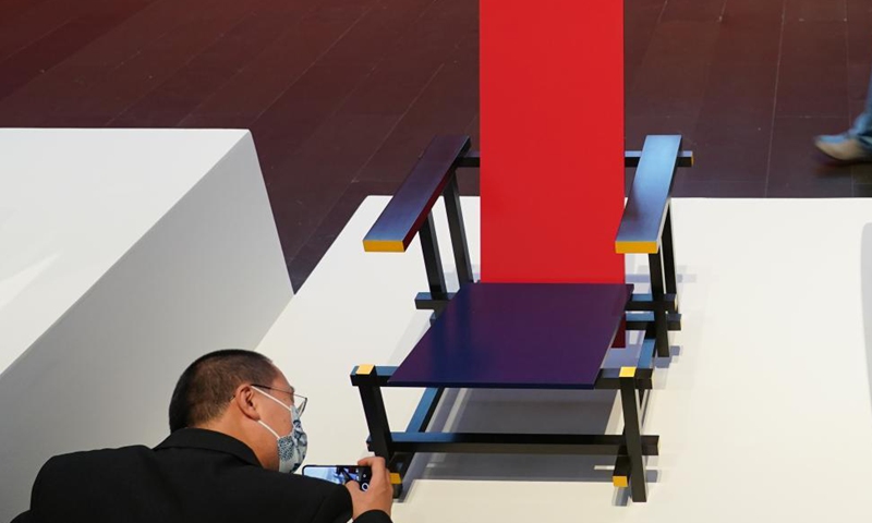 A visitor takes photos of an artwork by Gerrit Thomas Rietveld at an exhibition in Tsinghua University Art Museum in Beijing, capital of China, June 3, 2021. Displaying a total of 158 modern designs, the exhibition named 100 Years of Design History: The Biagetti-Koenig Collection is held in Tsinghua University Art Museum. The exhibition will last until August 25.Photo: Xinhua