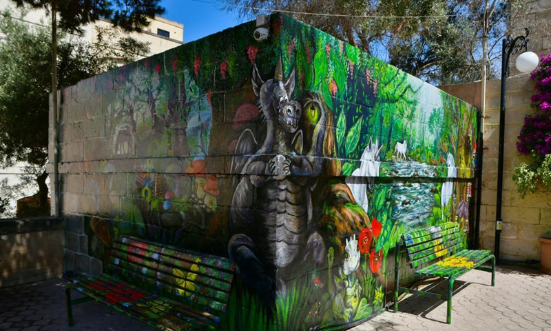 A mural created by artist Nathalie Micallef is seen at the Peace Garden in Gharghur, Malta, on June 3, 2021. Micallef has spent all her free time since January turning blank walls here into vibrant visuals.  Photo: Xinhua