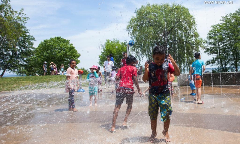 Children cool themselves at a splash pad in Mississauga, Ontario, Canada, on June 5, 2021. Environment Canada issued a heat warning for the Greater Toronto Area on Saturday.(Photo: Xinhua)