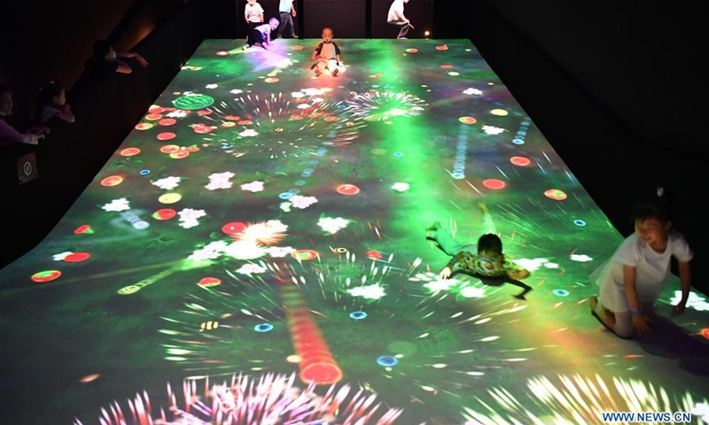 People visit the teamLab Future Park during an art festival themed on science and technology in Xi'an, northwest China's Shaanxi Province, June 6, 2021.(Photo: Xinhua)