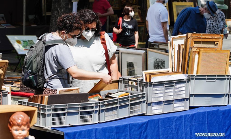 People visit a flea market in Berlin, Germany, June 6, 2021. Flea markets are allowed to reopen from June 4 after longtime closure due to COVID-19 pandemic, attracting many visitors at the weekend.(Photo: Xinhua)
