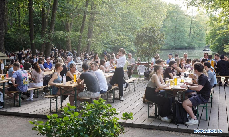 People are seen at a beer garden in Berlin, Germany, June 5, 2021. Germany will lift its vaccination prioritization scheme on June 7, making all citizens older than 12 years eligible to receive a COVID-19 vaccination, Minister of Health Jens Spahn announced on June 2. (Photo by Stefan Zeitz/Xinhua)