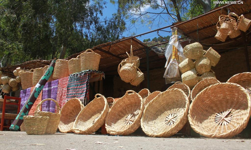 Reed crafts are seen along the roadside in the district of Koura, northern Lebanon, on June 5, 2021. The district of Koura is famous for its handicrafts made of reeds.(Photo: Xinhua)