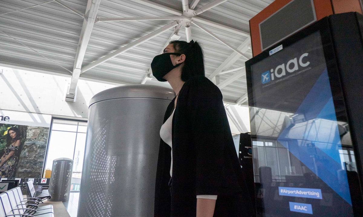 A passenger at Larnaca International Airport on May 17 Photo: AFP