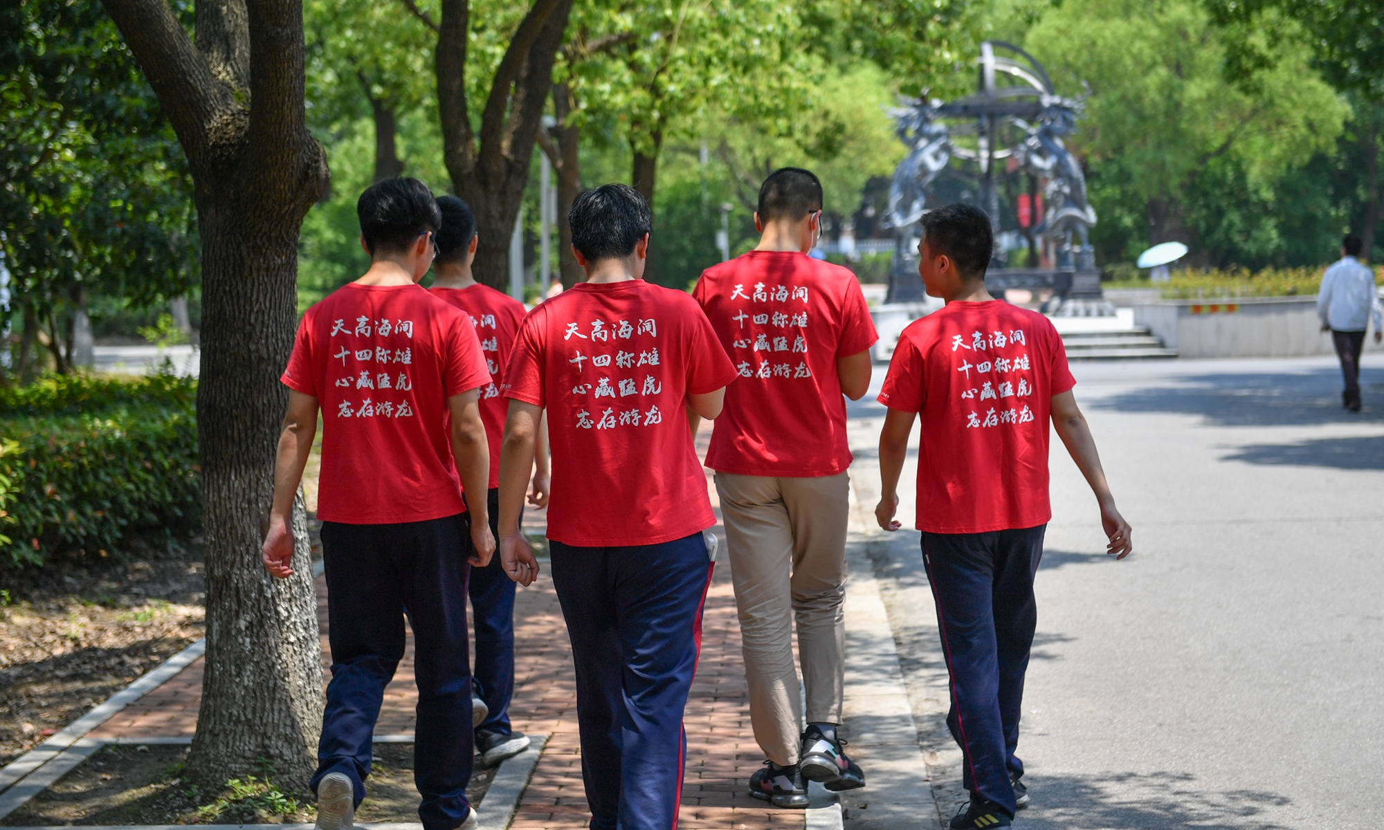Five students from Suzhou, East China's Jiangsu Province wear red T-shirts emblazoned with words of encouragement on Sunday. The students, along with 10.78 million other Chinese students are set to participate in the gaokao, the national college entrance examinations, scheduled for June 7 and 8. Photo: VCG