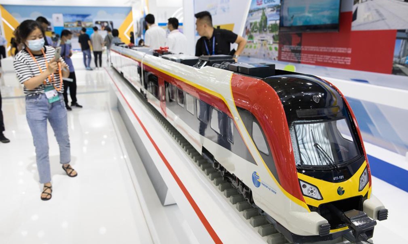 A visitor takes photos of a bullet train model at the second China-Central and Eastern European Countries (CEEC) Expo in Ningbo, east China's Zhejiang Province, June 9, 2021. The expo opened to public visitors on Wednesday. Themed Fostering a New Development Paradigm, Sharing a Win-Win Opportunity, the expo aims to boost trade between China and Central and Eastern European Countries (CEECs). Photo: Xinhua