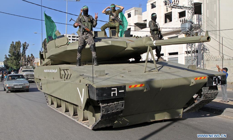 Members of the Ezz al-Din al-Qassam brigades, the military wing of the Palestinian Hamas movement, take part in a military parade at Tuffah neighborhood in Gaza City, on June 7, 2021.(Photo: Xinhua)