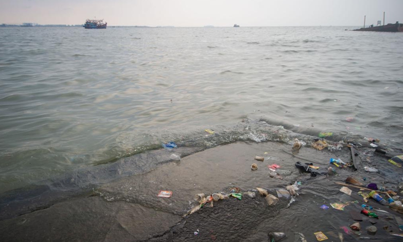Photo taken on June 8, 2021 shows waste on the seaside at Muara Angke fishing village of North Jakarta, Indonesia. June 8 marks World Oceans Day. This year's theme is The Ocean: Life and Livelihoods. (Photo by Veri Sanovri/Xinhua)